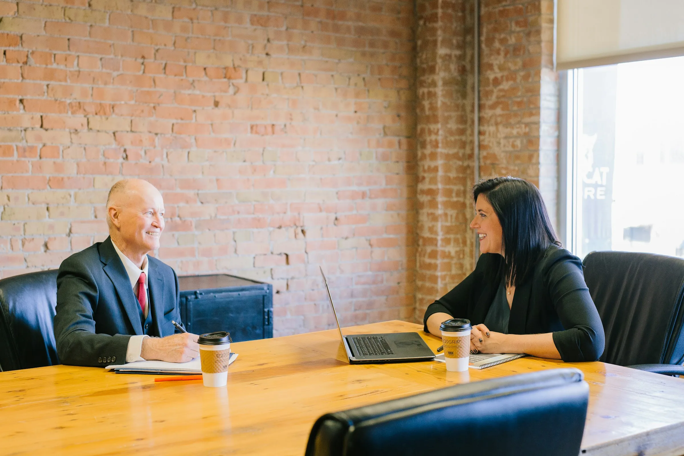 Ivanne Tonnessen in consultation with a client at Breton Law's San Diego office